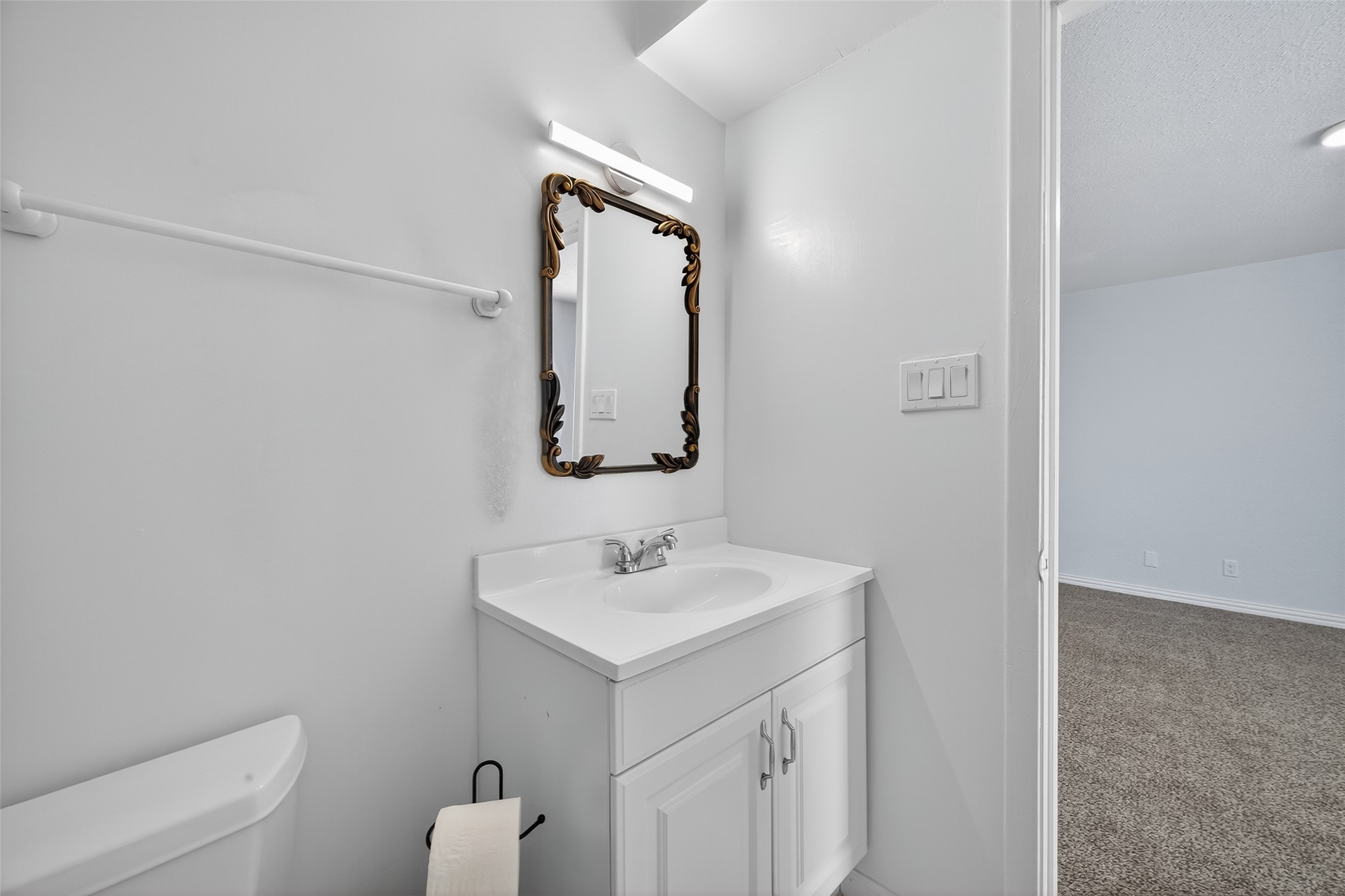 6201 Ranchester Drive, Unit 29 Houston, TX 77036 - Photo 13 of 33 a bathroom with a sink toilet and mirror