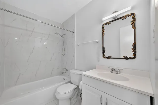 a bathroom with a shower and a bathtub