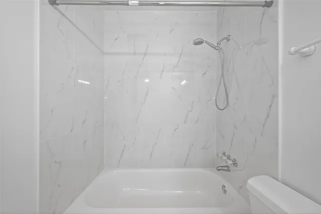 a view of an empty room and closet area