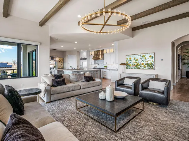 a living room with furniture windows and a flat screen tv