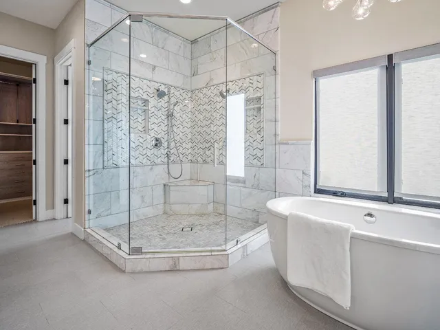 a living room with furniture a flat screen tv and a rug