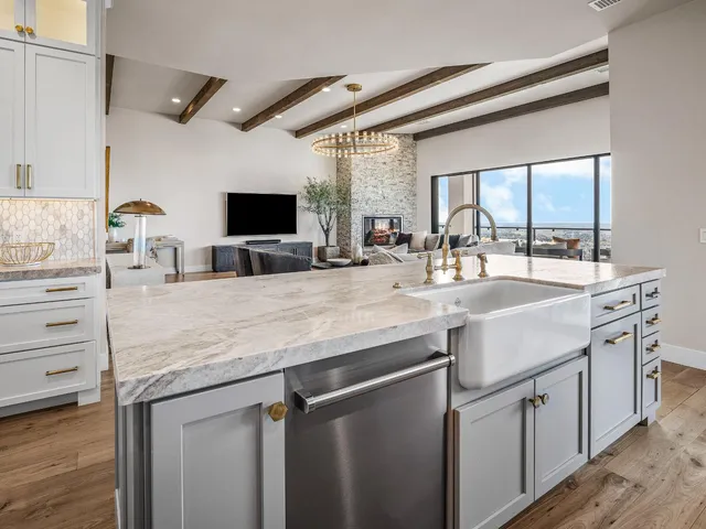 a living room with furniture fireplace and flat screen tv