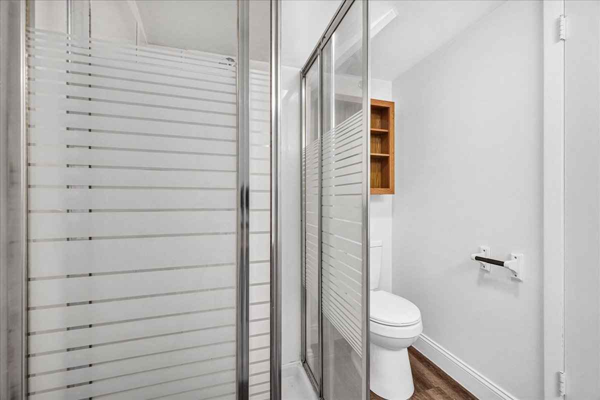 340 East Baker Street Bloomington, IL 61701 - Photo 19 of 28 a bathroom with a toilet and a shower