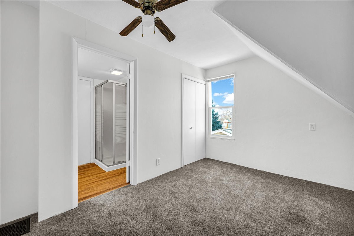 340 East Baker Street Bloomington, IL 61701 - Photo 20 of 28 an empty room with closet and windows