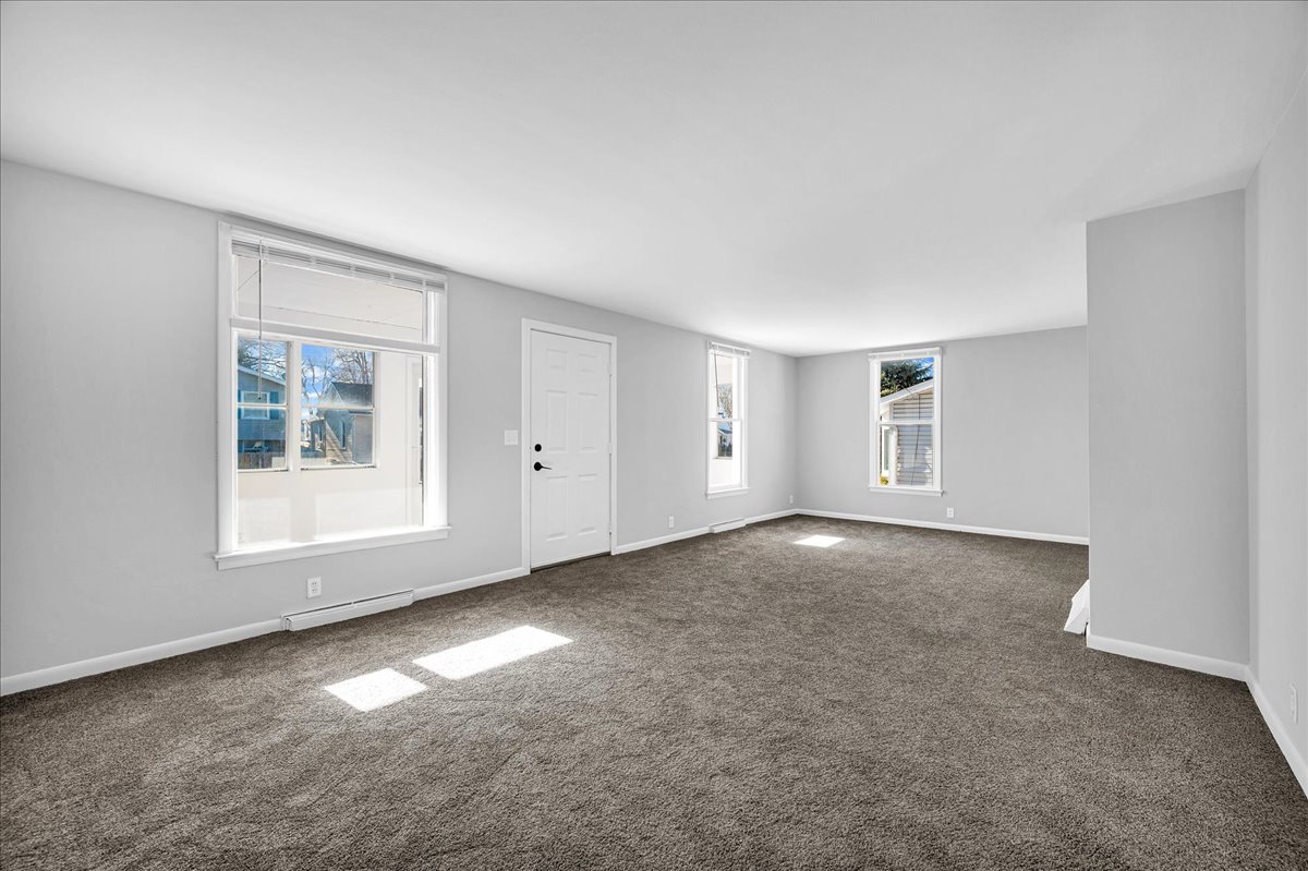 340 East Baker Street Bloomington, IL 61701 - Photo 4 of 28 a view of an empty room with a window