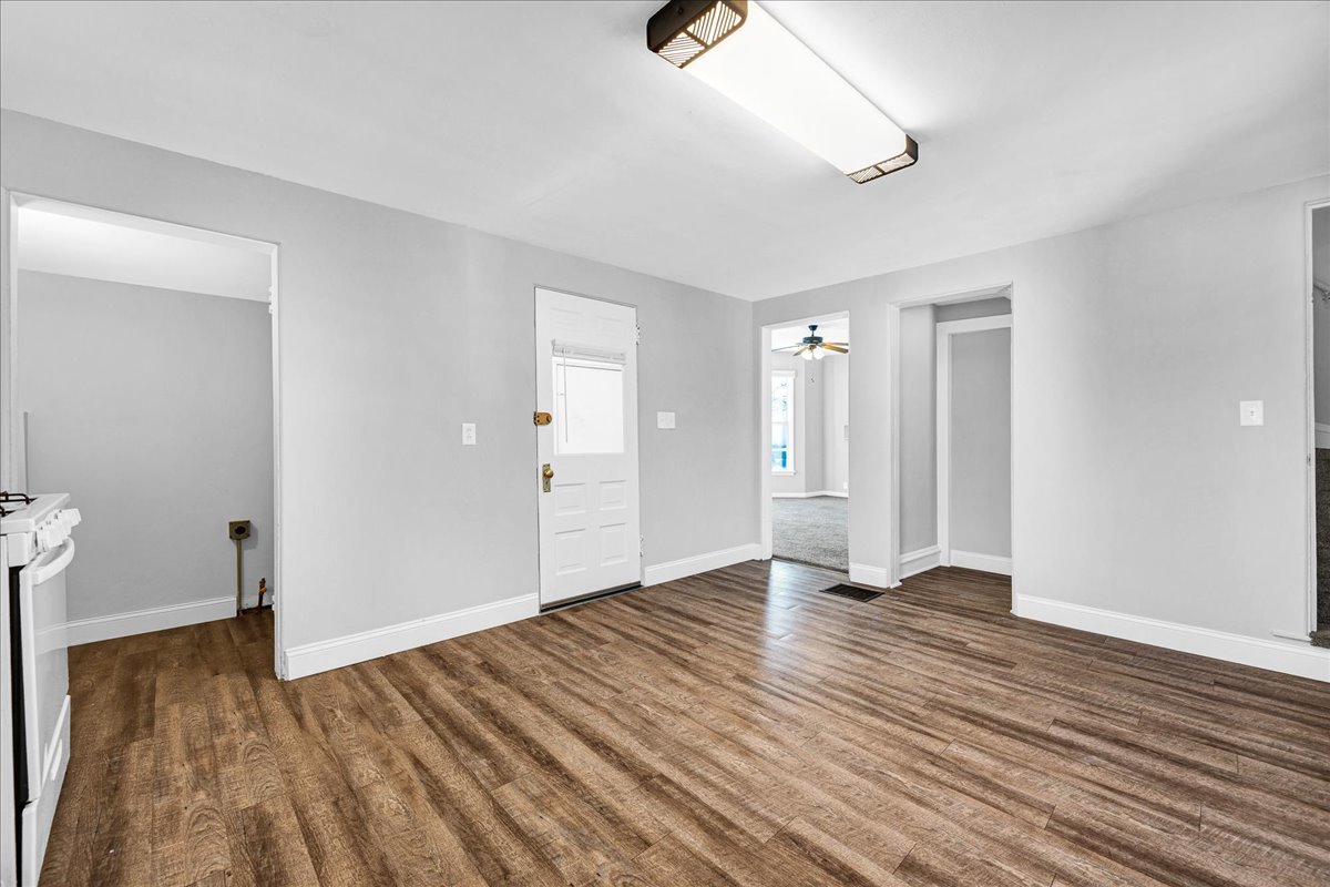 340 East Baker Street Bloomington, IL 61701 - Photo 9 of 28 a view of an empty room with wooden floor