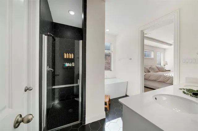 a en suite bathroom with a tub and shower