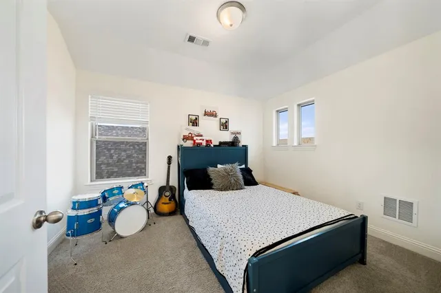 a bedroom with a bed and furniture