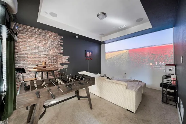 a room with table chairs and a stove