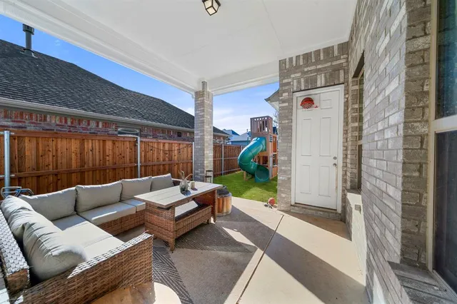 a living room with furniture and a rug