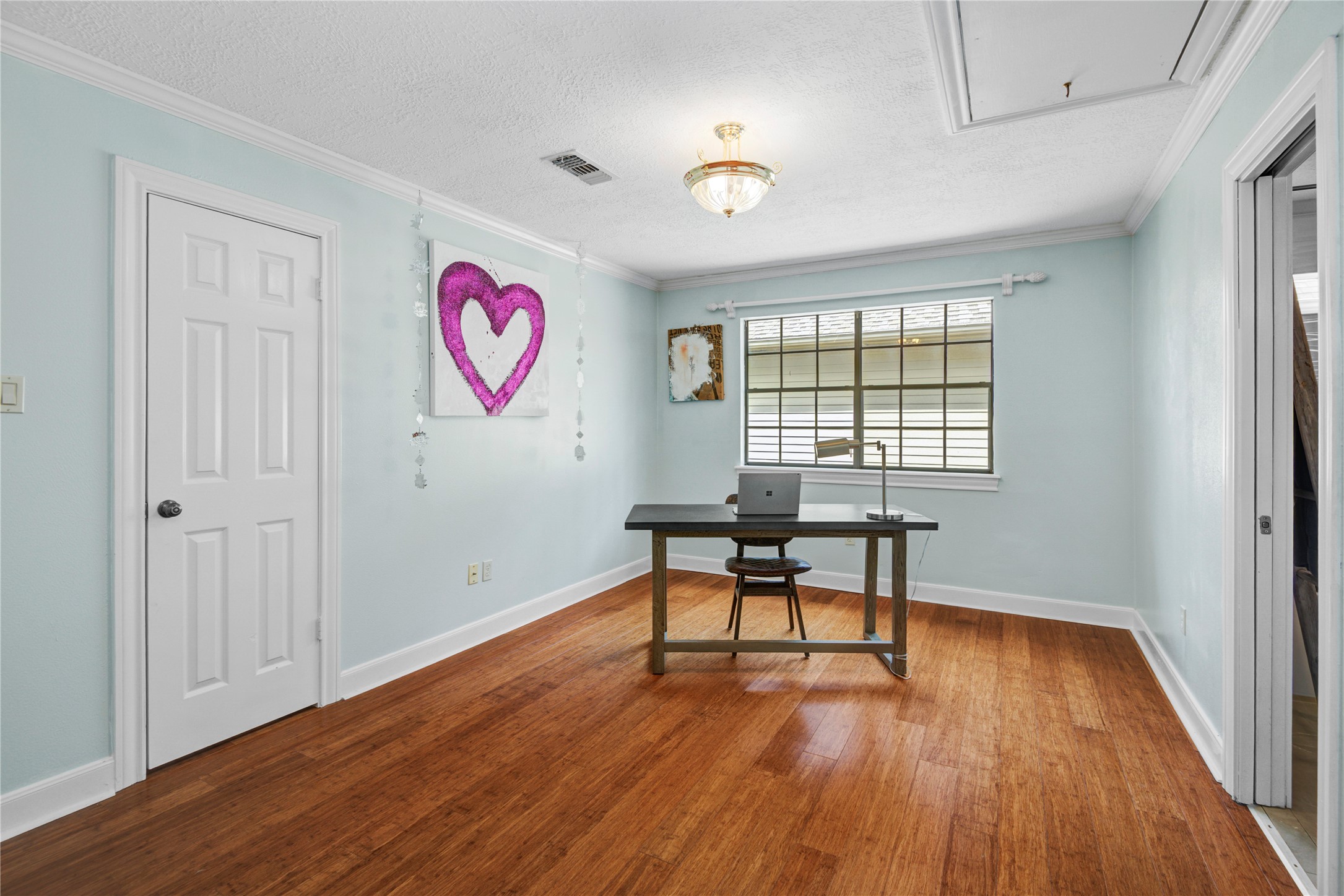 8412 Hidden Trail Lane Spring, TX 77379 - Photo 25 of 43 Currently styled as a home office, this versatile upstairs bedroom offers beautiful natural light and flexible space for work, study, or guests.