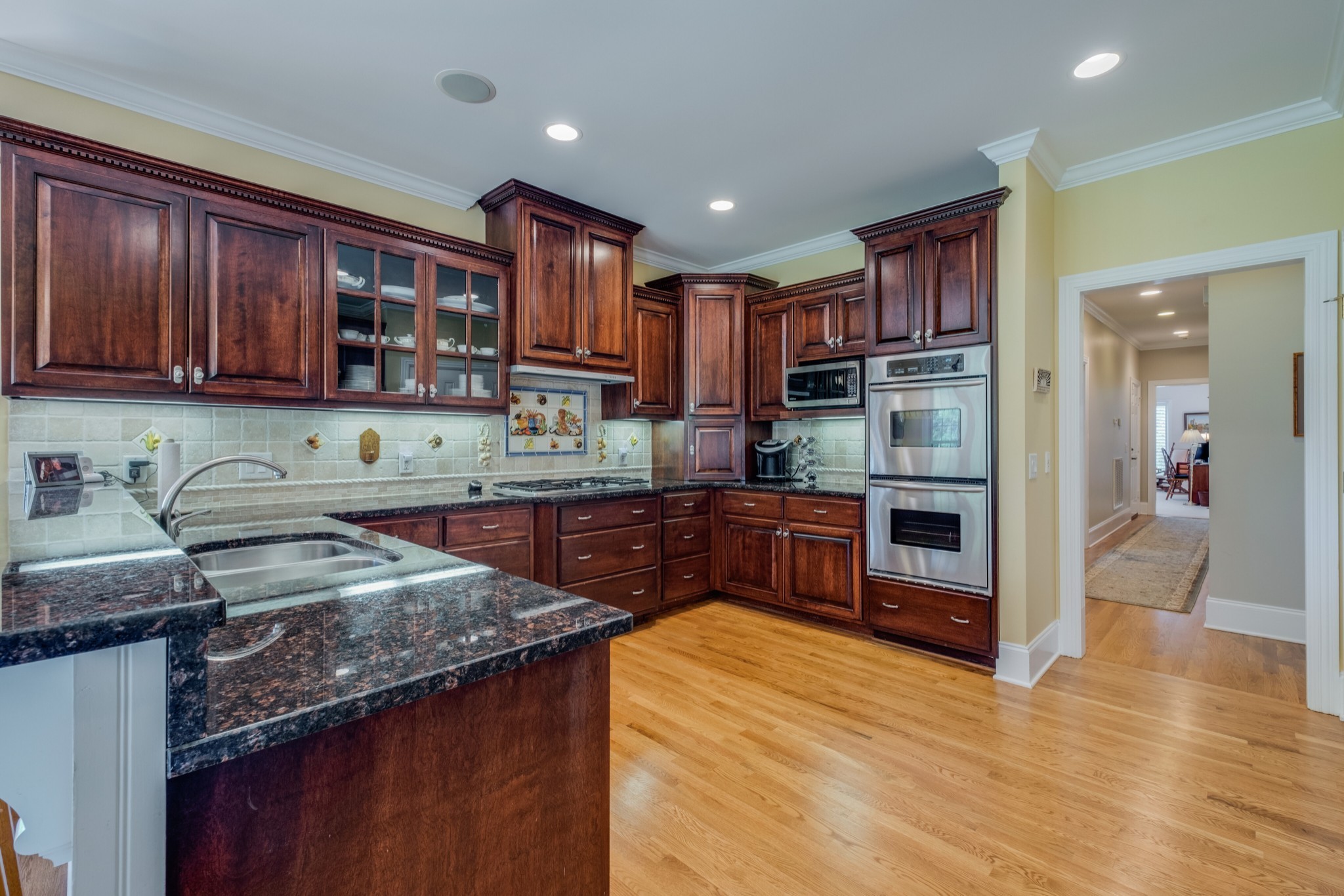 423 Ridgecrest Lane Lebanon, TN 37087 - Photo 17 of 50 a kitchen with stainless steel appliances granite countertop a sink counter space cabinets and a counter top space