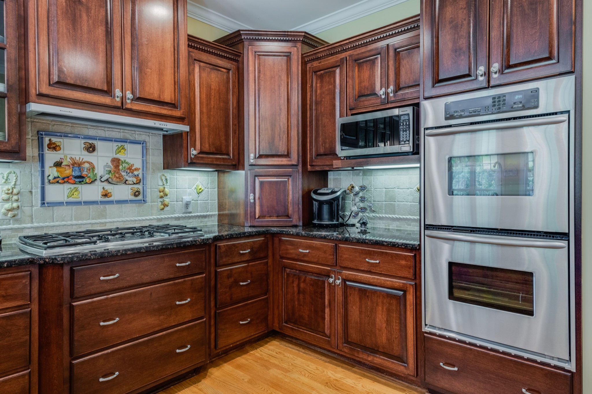 423 Ridgecrest Lane Lebanon, TN 37087 - Photo 18 of 50 a kitchen with stainless steel appliances granite countertop a stove microwave and cabinets