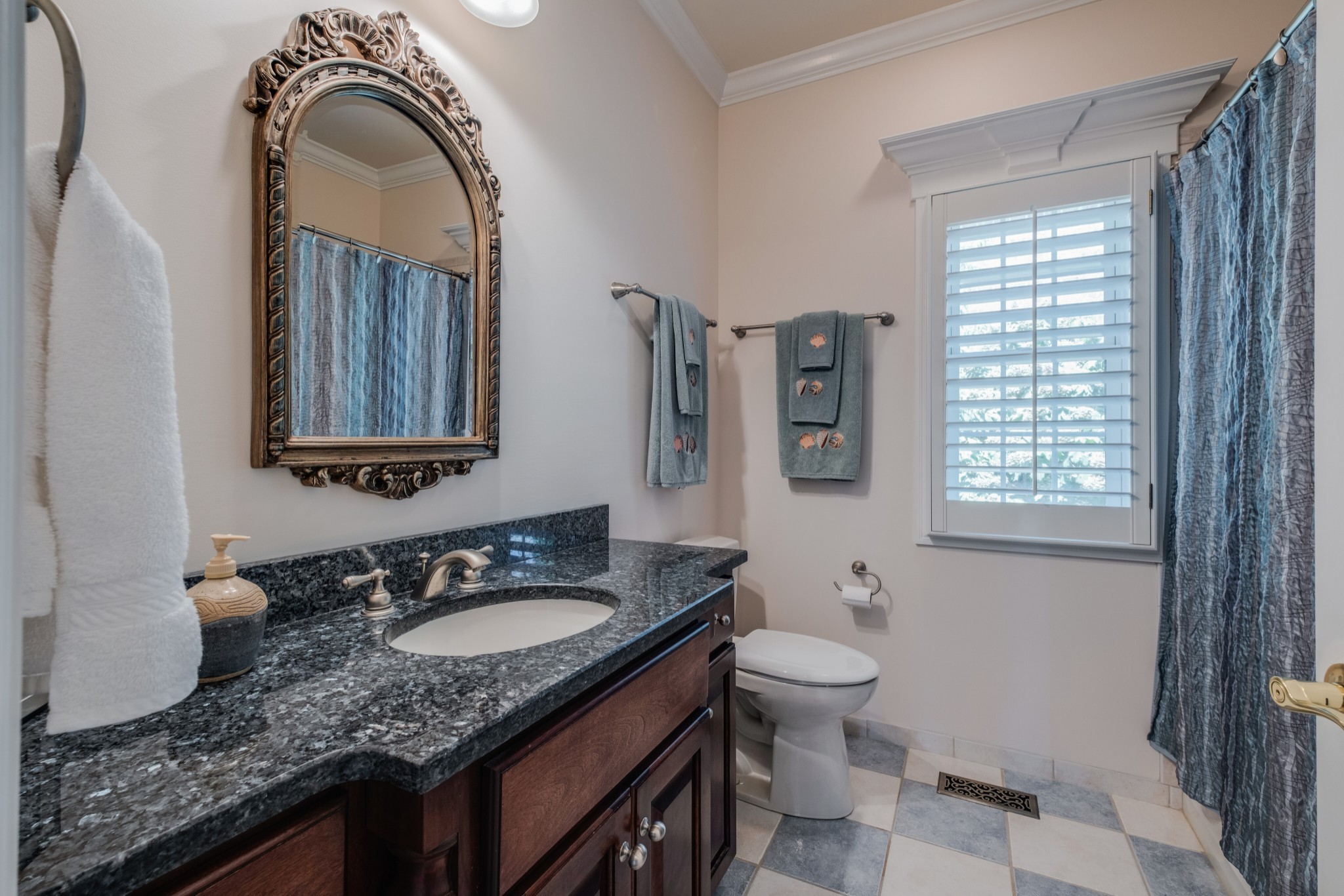 423 Ridgecrest Lane Lebanon, TN 37087 - Photo 30 of 50 a bathroom with a granite countertop sink a toilet and a mirror
