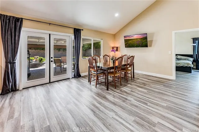a view of a livingroom with furniture and a flat screen tv