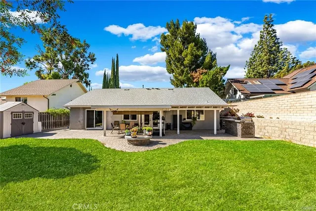 a view of a house with a yard porch and sitting area