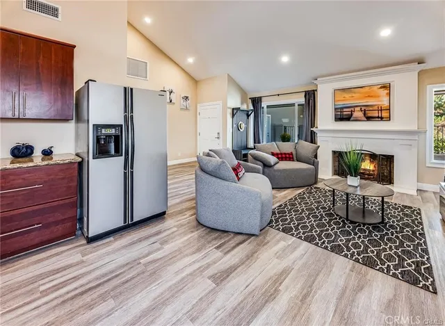 a living room with furniture and a fireplace