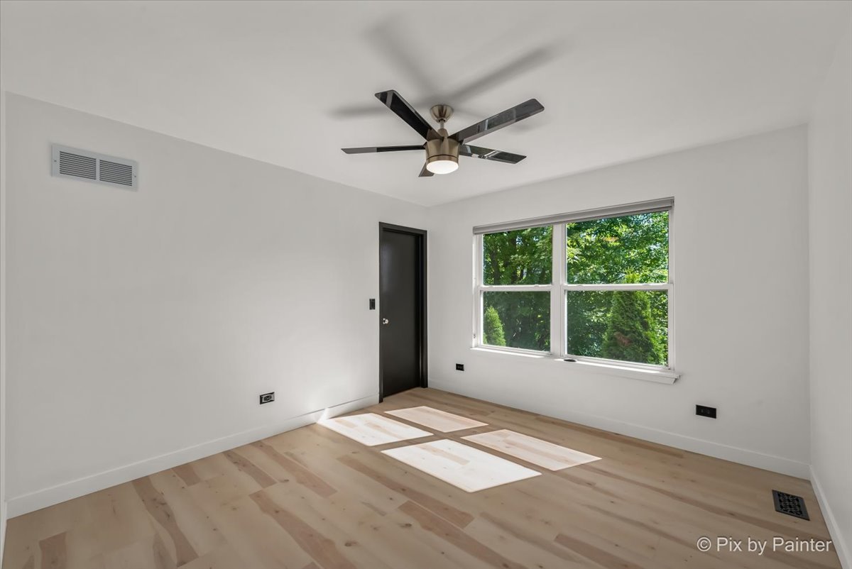 1812 Arbor Fields Drive Plainfield, IL 60586 - Photo 19 of 35 a view of an empty room with a window