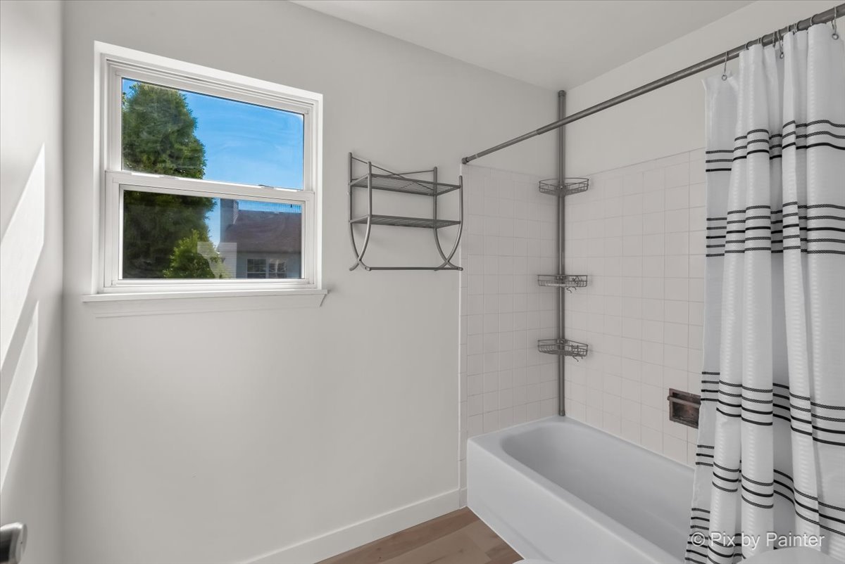 1812 Arbor Fields Drive Plainfield, IL 60586 - Photo 21 of 35 a bathroom with a bathtub and a shower