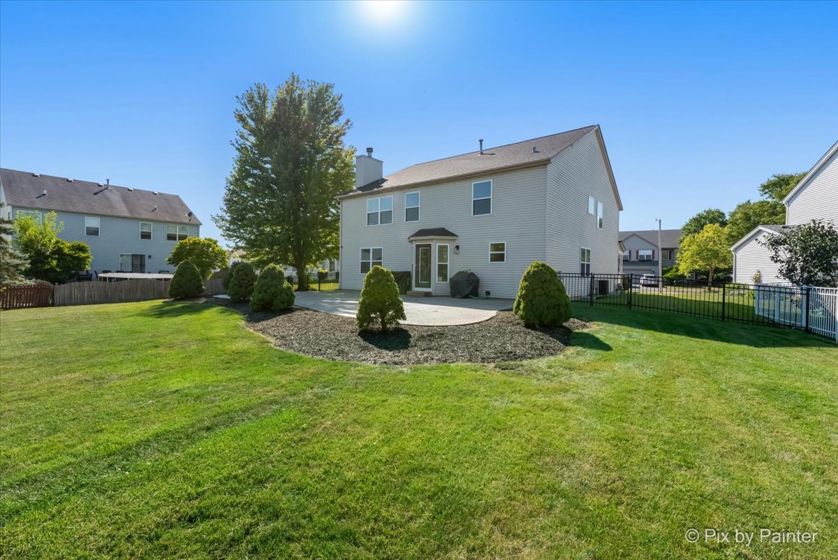 1812 Arbor Fields Drive Plainfield, IL 60586 - Photo 24 of 35 a view of a house with backyard and garden