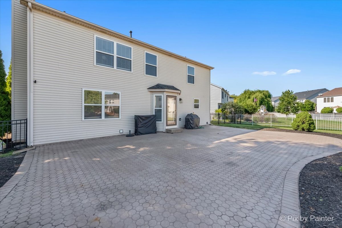 1812 Arbor Fields Drive Plainfield, IL 60586 - Photo 25 of 35 a view of a house with a backyard