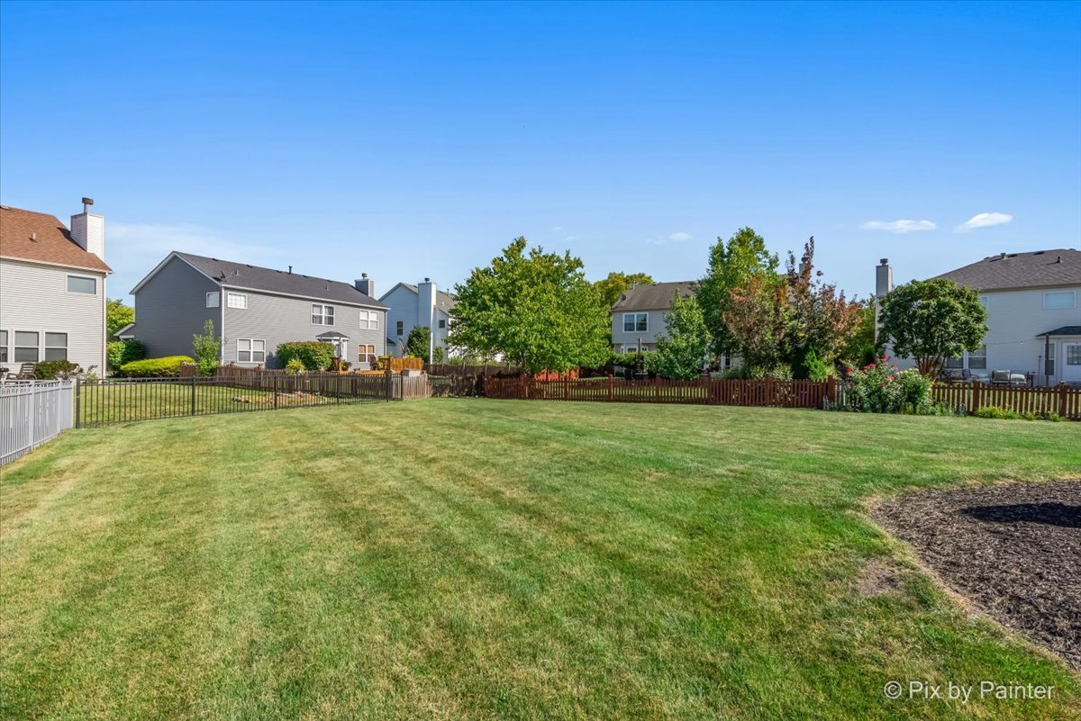 1812 Arbor Fields Drive Plainfield, IL 60586 - Photo 27 of 35 a view of yard with swimming pool and green space