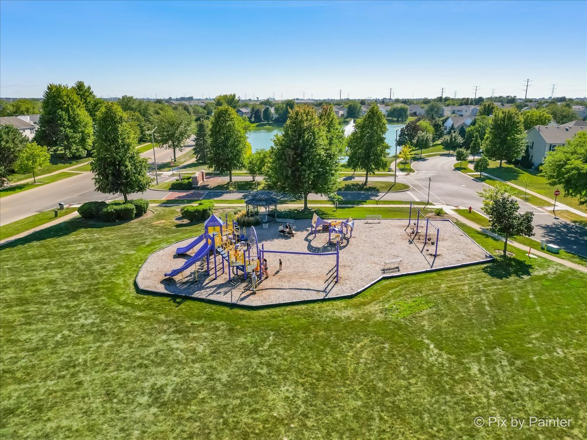 1812 Arbor Fields Drive Plainfield, IL 60586 - Photo 31 of 35 a view of a swimming pool with a yard