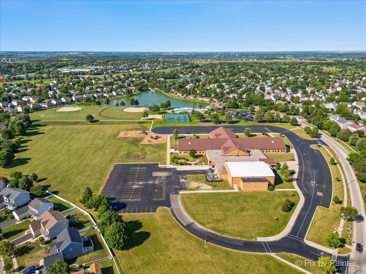 1812 Arbor Fields Drive Plainfield, IL 60586 - Photo 32 of 35 an aerial view of a swimming pool with a yard