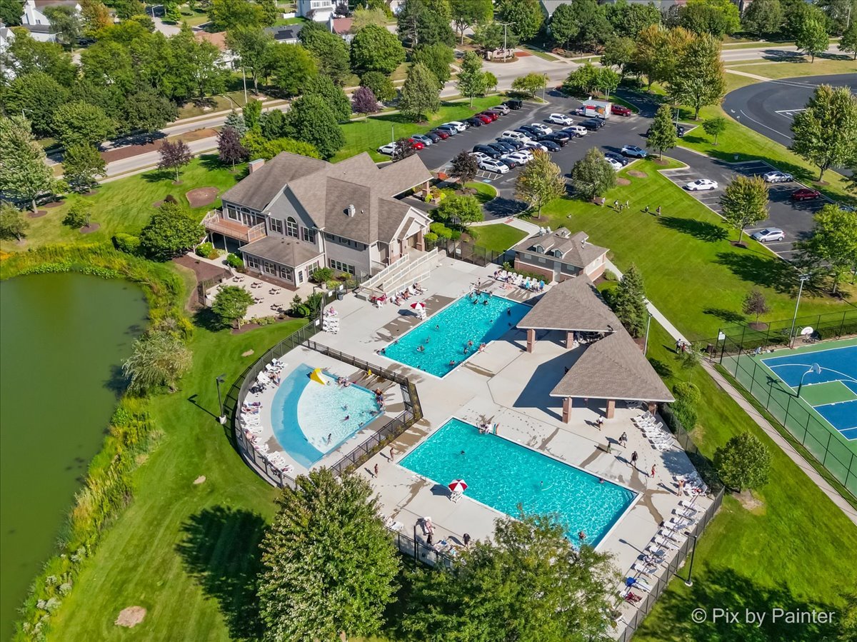 1812 Arbor Fields Drive Plainfield, IL 60586 - Photo 35 of 35 an aerial view of a house with a garden and lake view