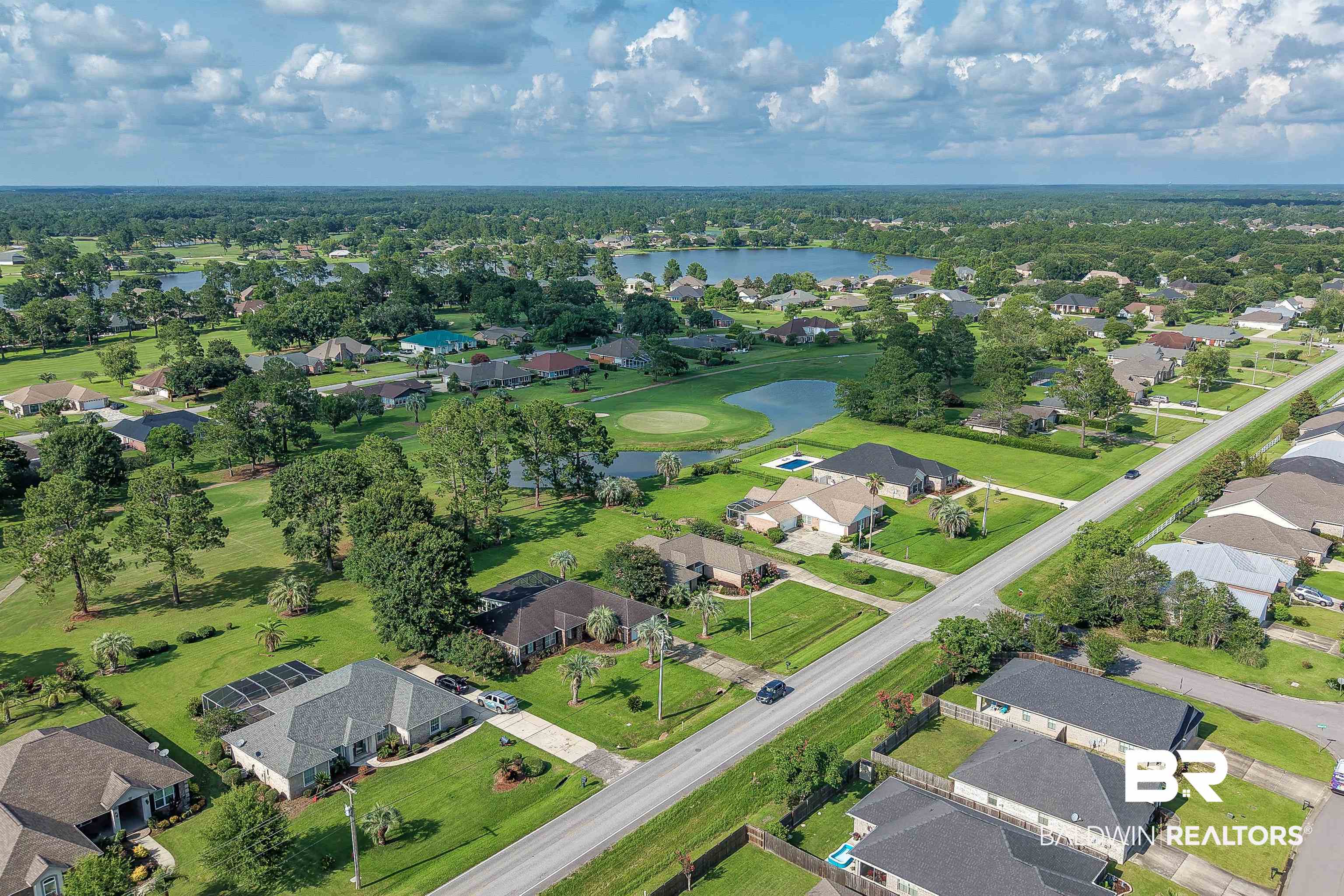22685 County Road 12 Foley, AL 36535 - Photo 81 of 89 Aerial perspective of a residential community featuring extensive green spaces and mature trees