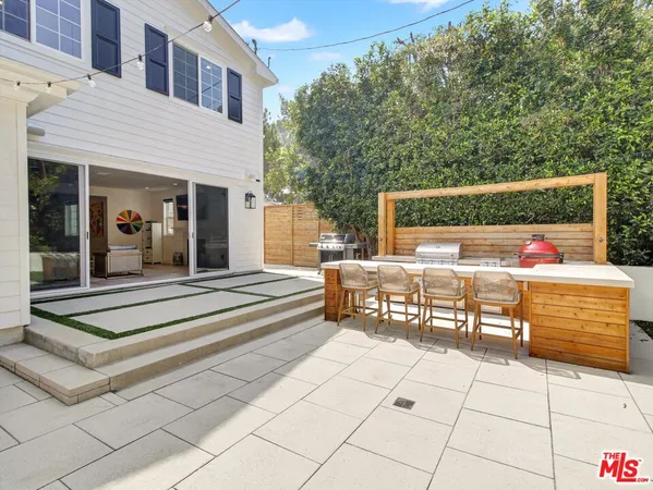 swimming pool view with a outdoor seating