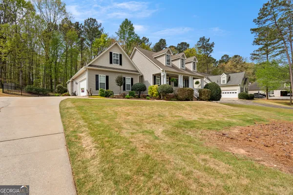 a front view of a house with garden