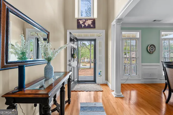 a view of a dining room with furniture window and wooden floor