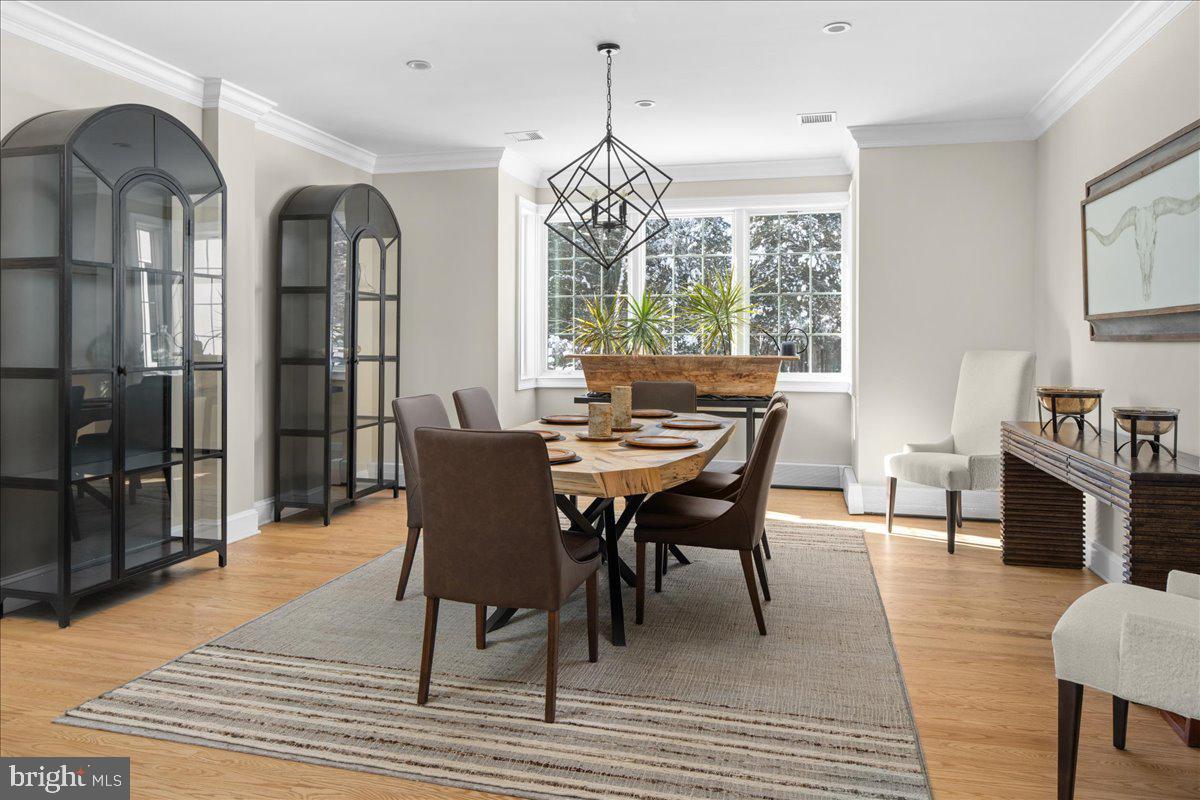 2 Cedar Lane Erwinna, PA 18920 - Photo 11 of 69 a dining room with wooden floor a chandelier a wooden table and chairs