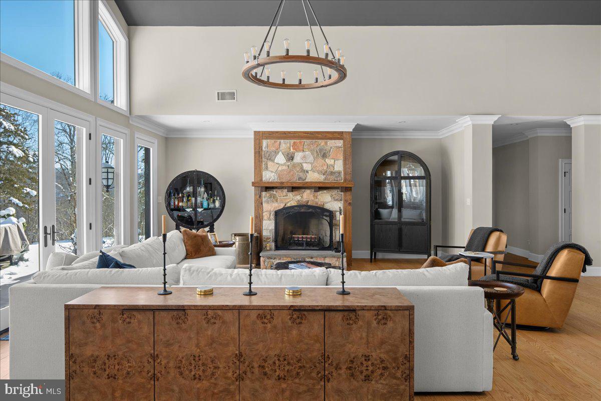 2 Cedar Lane Erwinna, PA 18920 - Photo 8 of 69 a living room with fireplace furniture and a chandelier