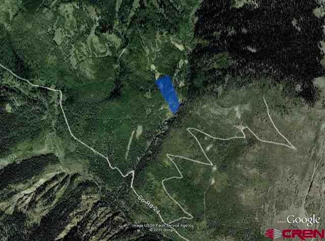 Tbd North Henson Creek Road Lake City, CO 81235 - Photo 2 of 12 a backyard of a house with lots of green space and trees