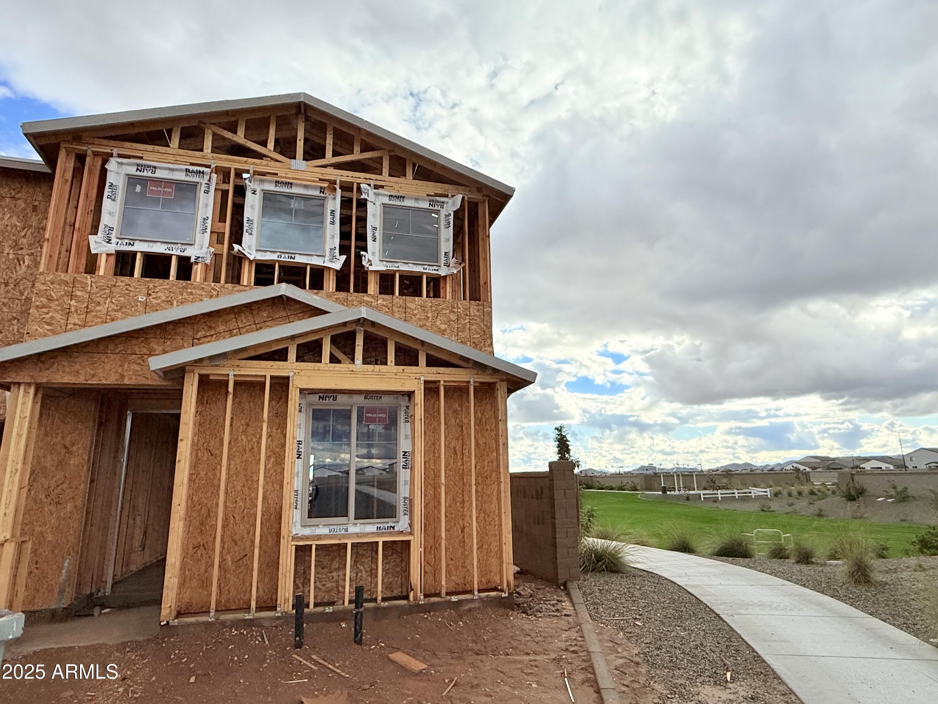 2329 Rolling Pr Lane San Tan Valley, AZ 85140 - Photo 2 of 19 a front view of a house with a yard