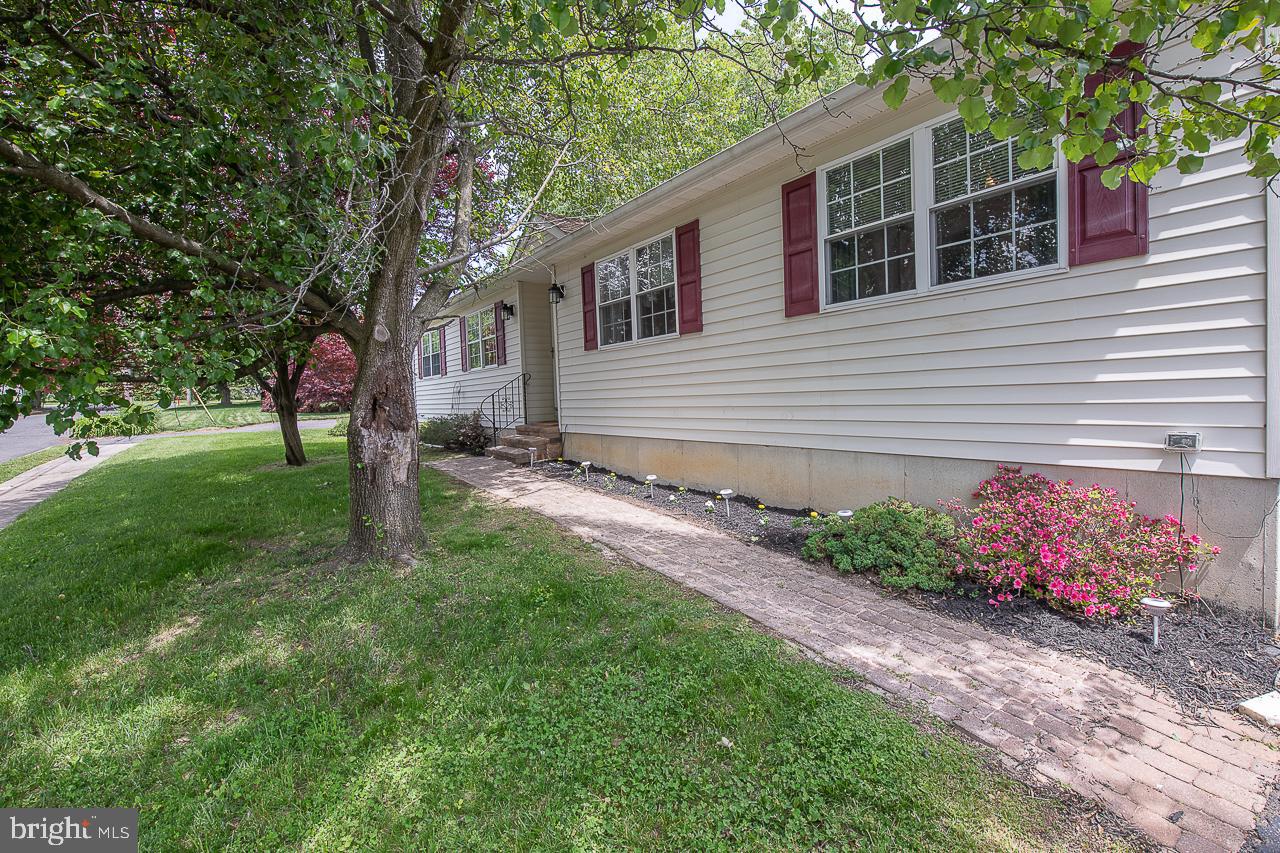 527 Schick Road Aston, PA 19014 - Photo 1 of 28 a front view of a house with garden