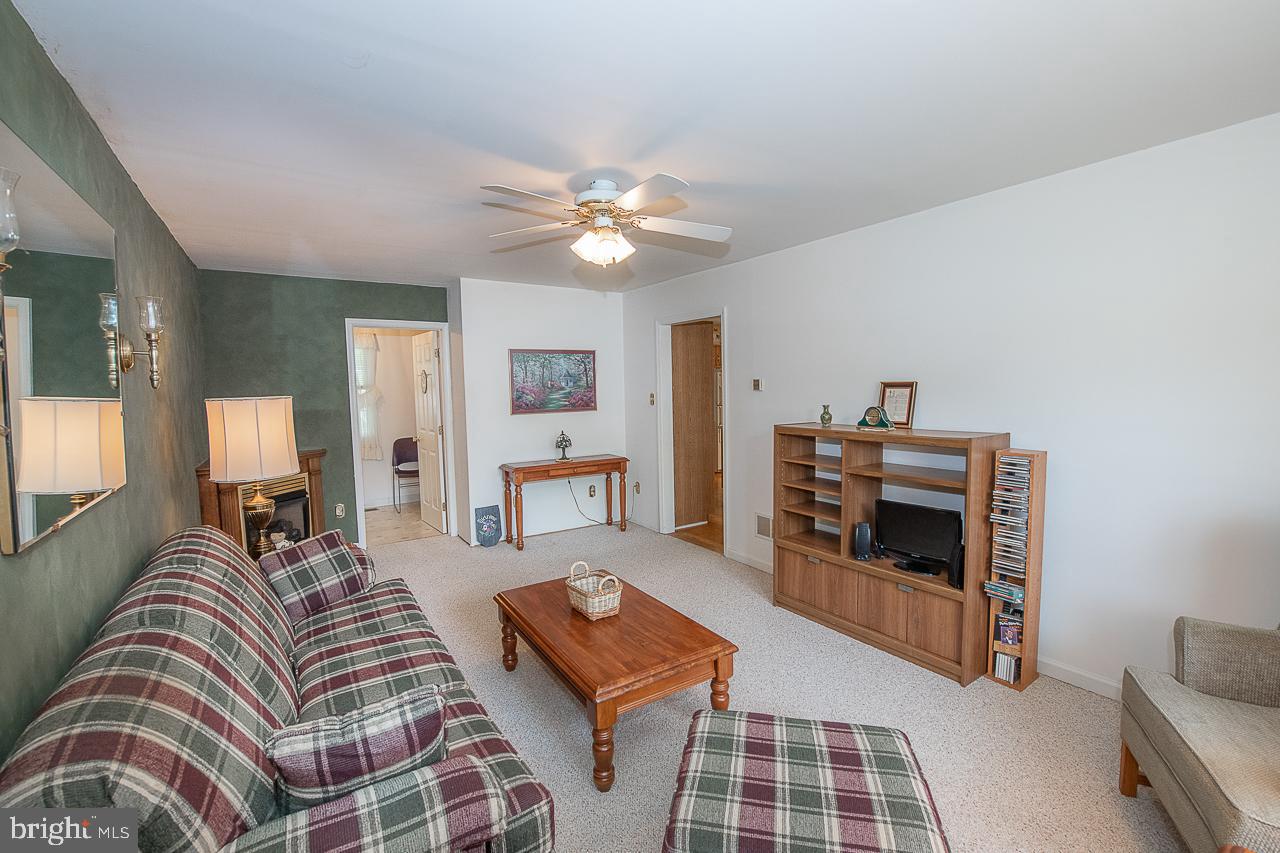 527 Schick Road Aston, PA 19014 - Photo 15 of 28 a living room with furniture and a fireplace