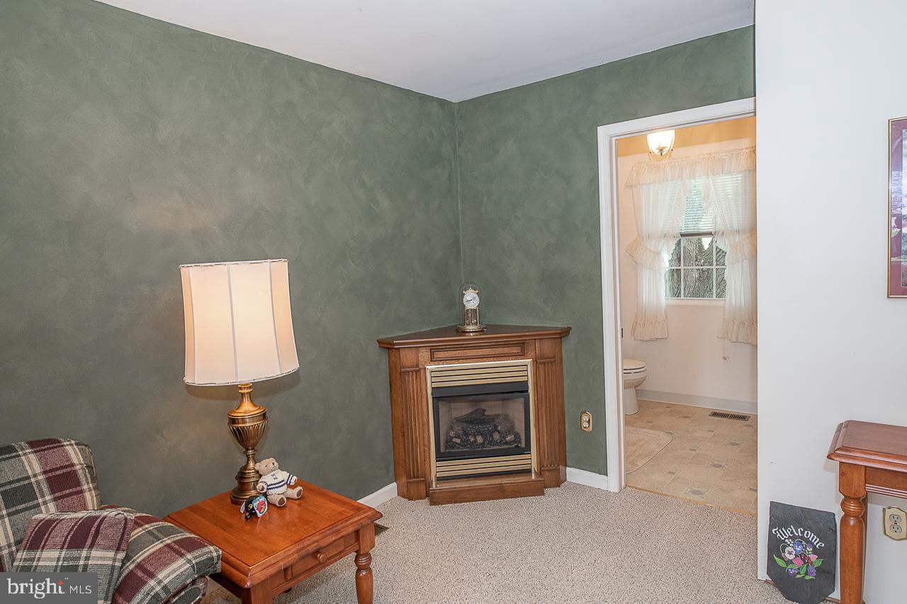 527 Schick Road Aston, PA 19014 - Photo 17 of 28 a living room with furniture and a fireplace