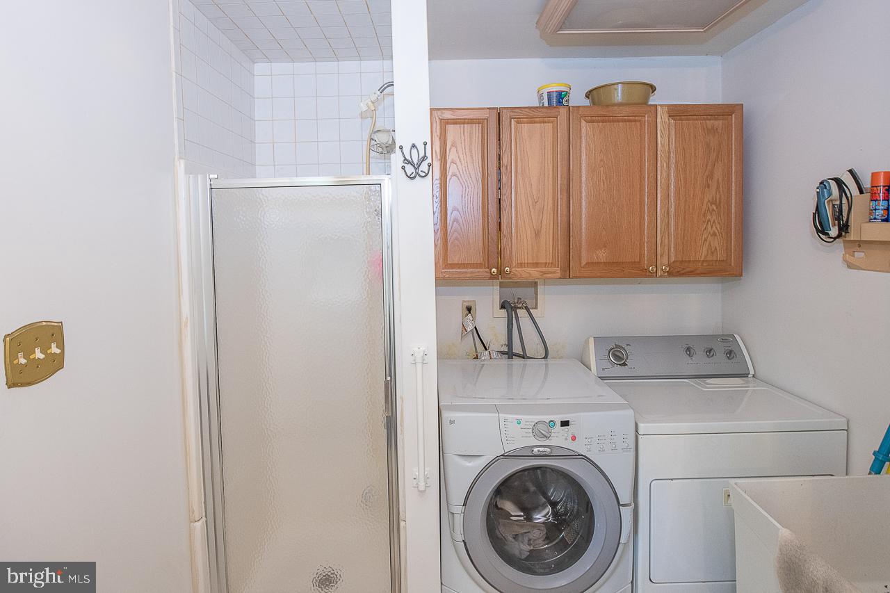 527 Schick Road Aston, PA 19014 - Photo 18 of 28 a view of a storage and utility room with washer and dryer