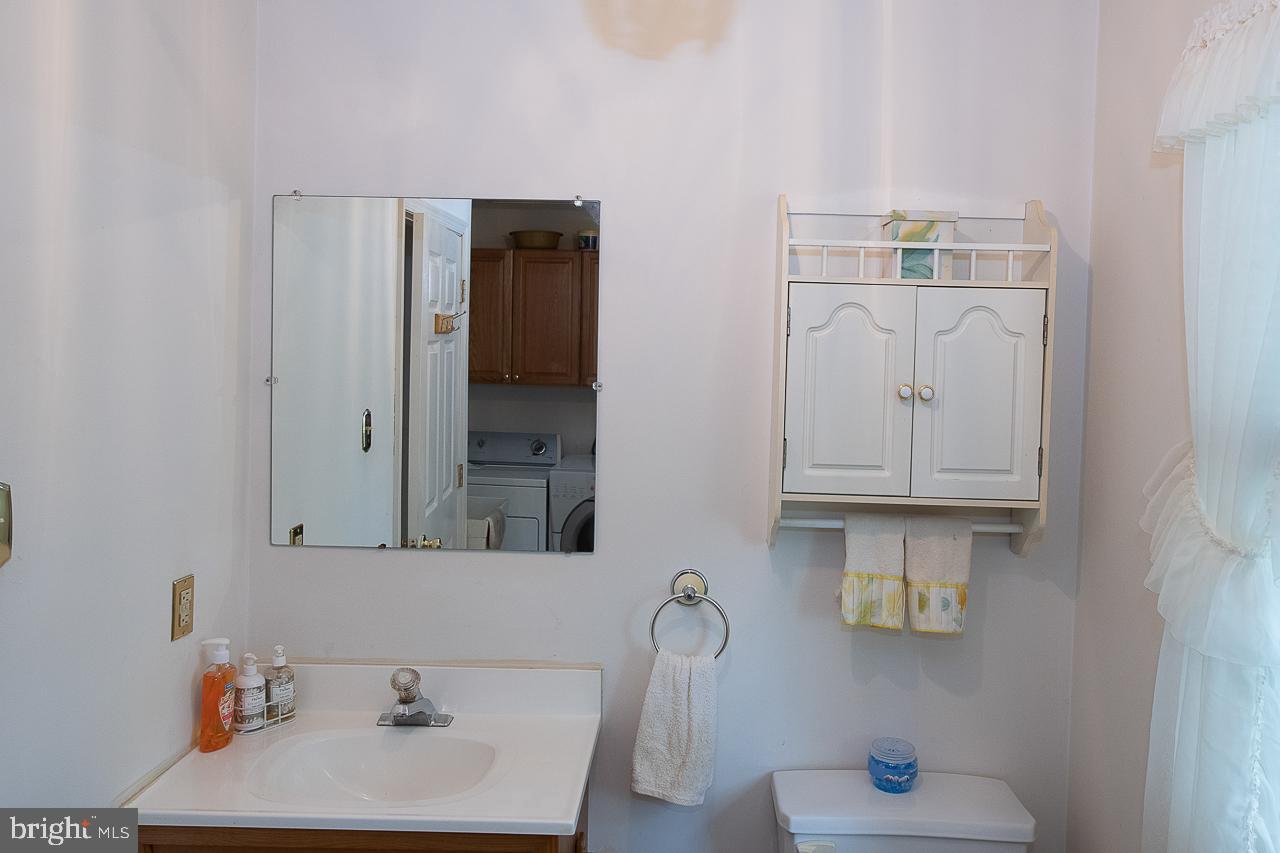 527 Schick Road Aston, PA 19014 - Photo 19 of 28 a bathroom with a sink and a mirror