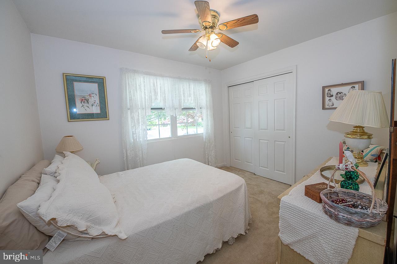 527 Schick Road Aston, PA 19014 - Photo 21 of 28 a bedroom with a bed couch and window