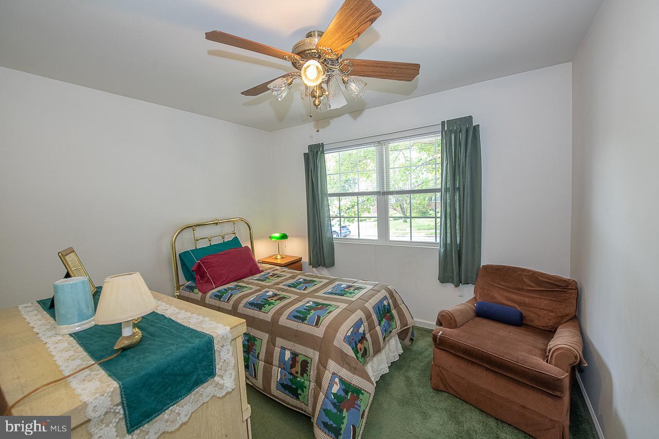 527 Schick Road Aston, PA 19014 - Photo 22 of 28 a bedroom with a bed and a couch