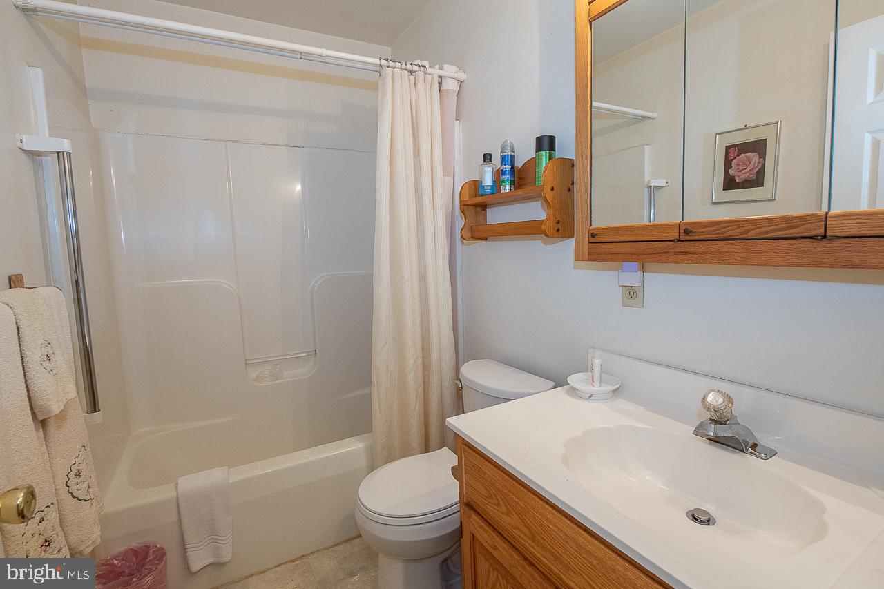 527 Schick Road Aston, PA 19014 - Photo 23 of 28 a bathroom with a sink toilet and shower
