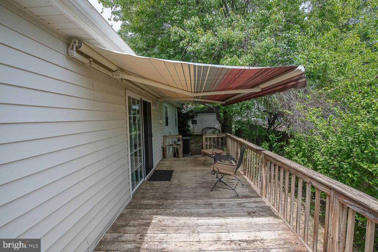 527 Schick Road Aston, PA 19014 - Photo 25 of 28 a view of backyard with green space and wooden deck