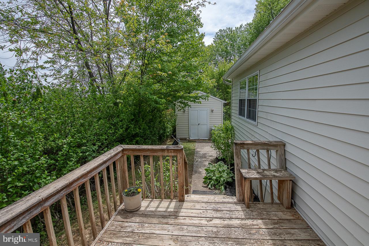 527 Schick Road Aston, PA 19014 - Photo 26 of 28 a view of a wooden deck and a backyard