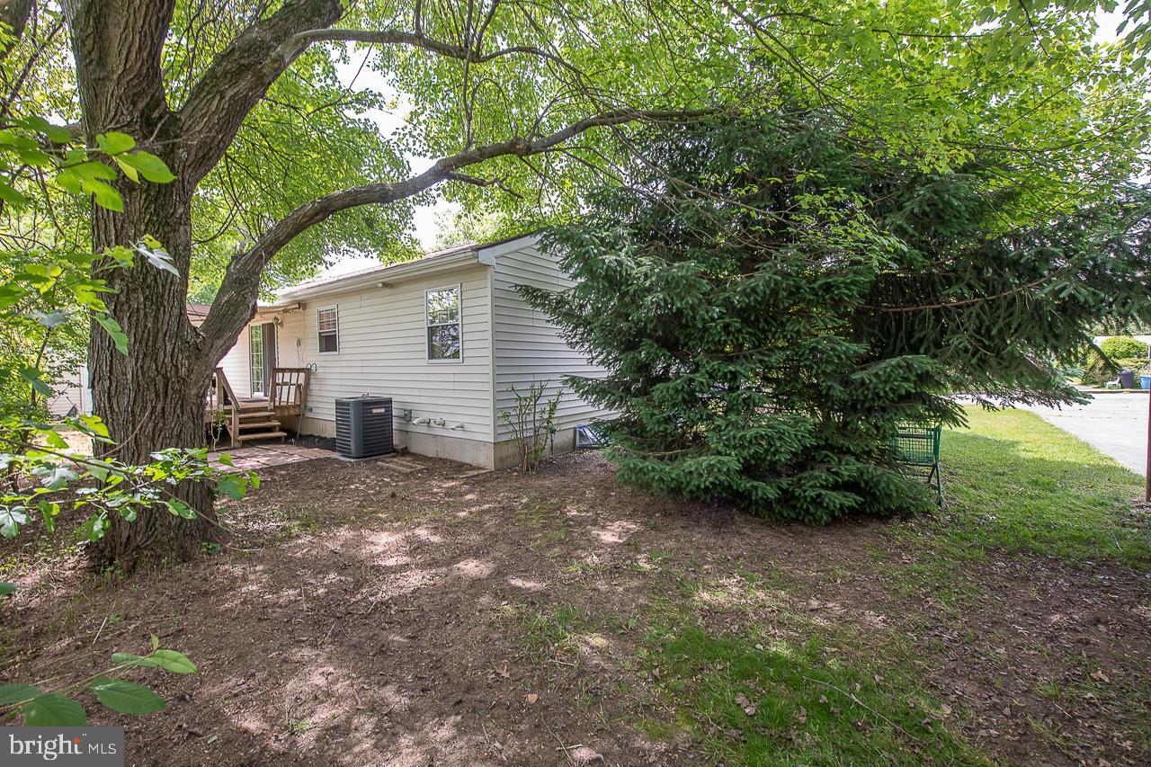 527 Schick Road Aston, PA 19014 - Photo 28 of 28 a view of a house with a tree in the background
