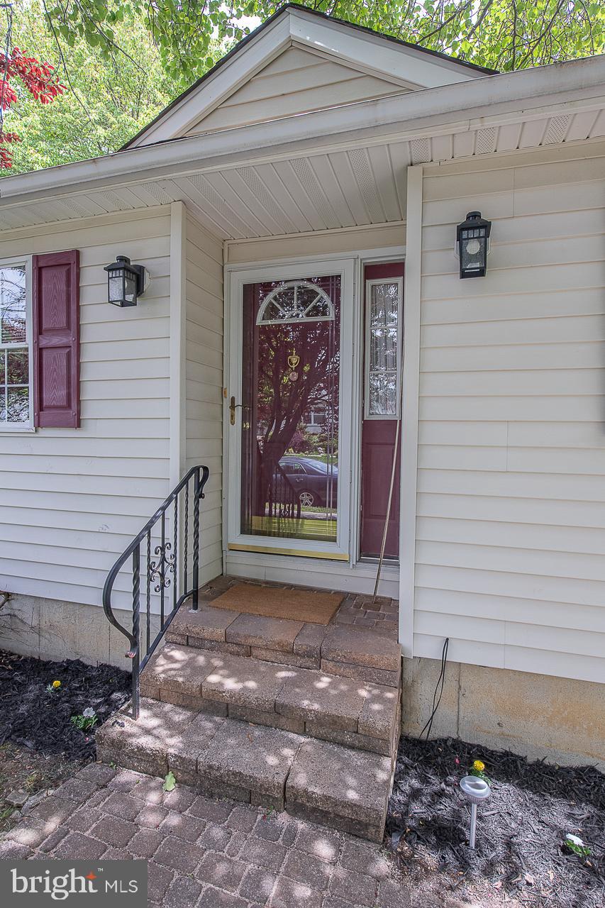 527 Schick Road Aston, PA 19014 - Photo 6 of 28 a view of a house with a door and wooden walls