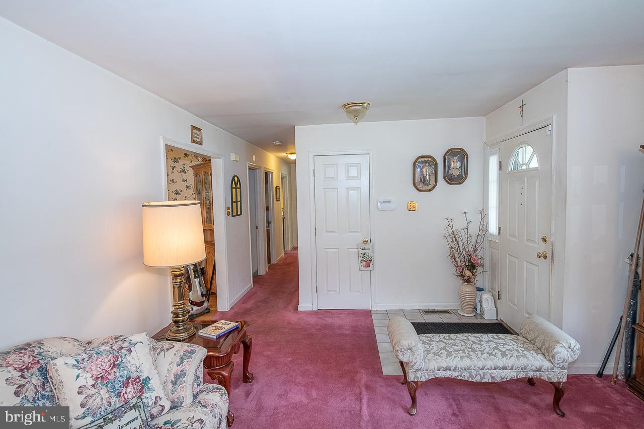 527 Schick Road Aston, PA 19014 - Photo 10 of 28 a living room with furniture and a window